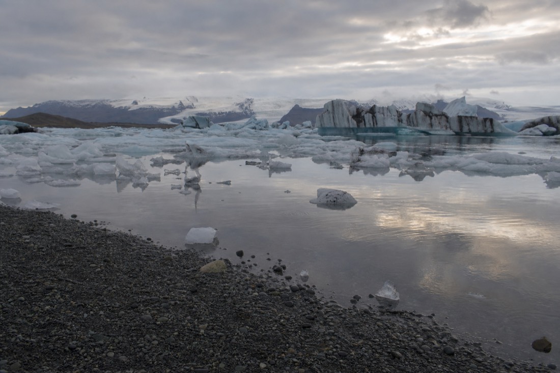 Quiet autumn afternoon at Jokulsarlon glacier lagoon with few visitors and soft low light